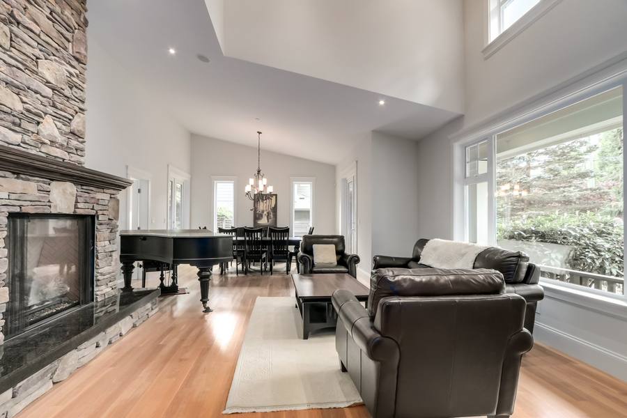 Grand living room with stone fireplace